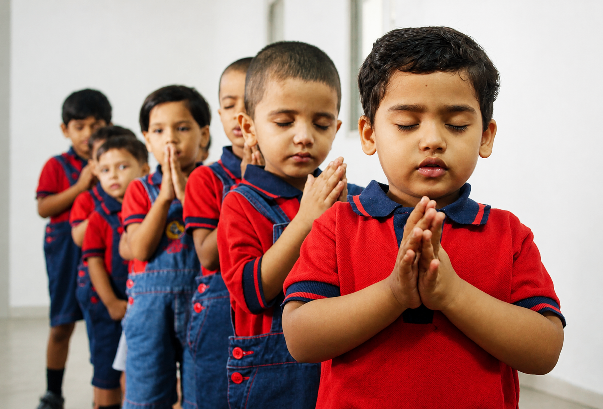 Children in morning prayer at De Mother's Lap